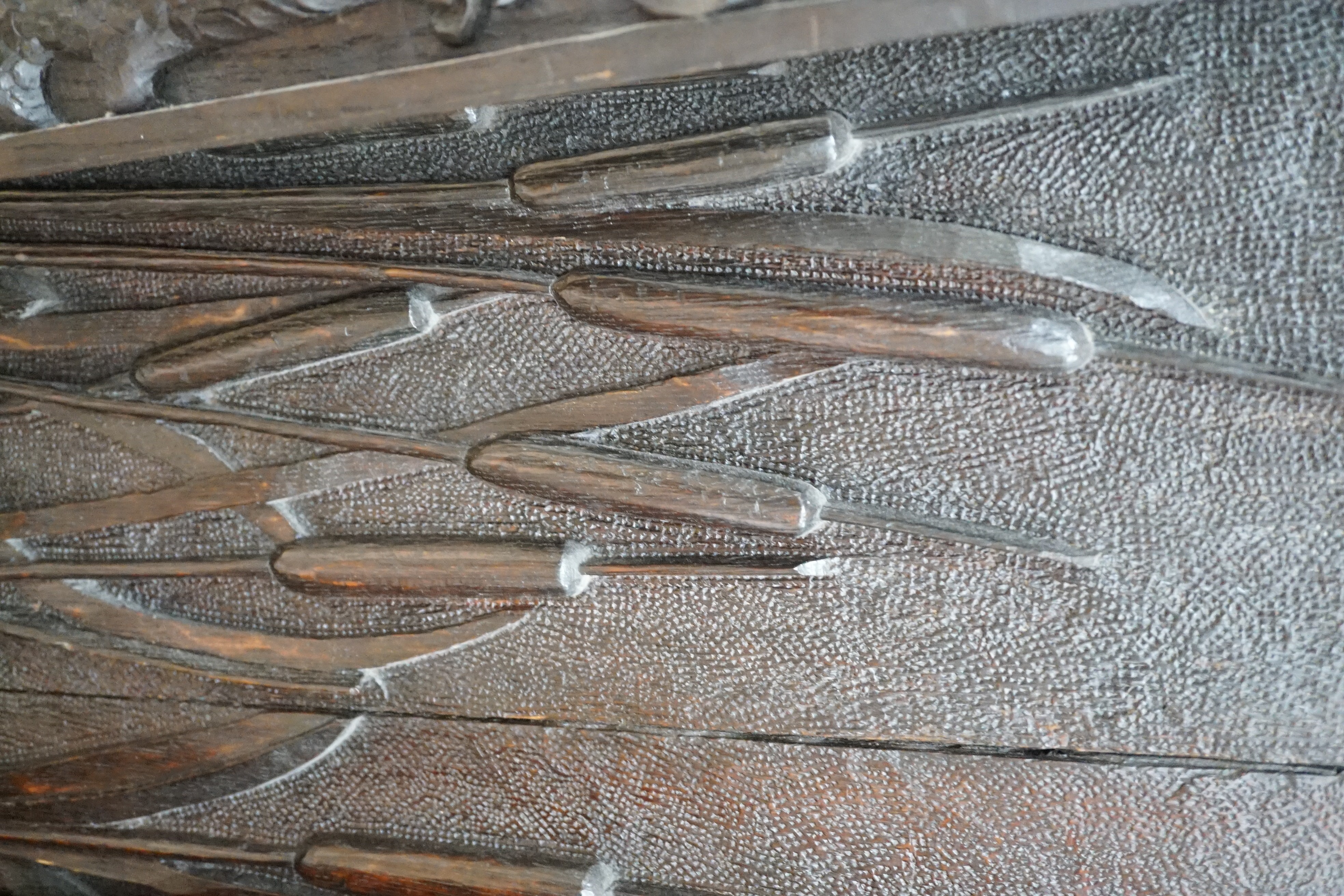 Seven assorted carved wooden panels, widest 166 cms